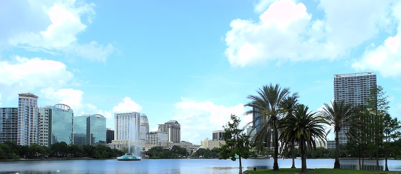 Orlando downtown skyline reflected across Lake Eola
